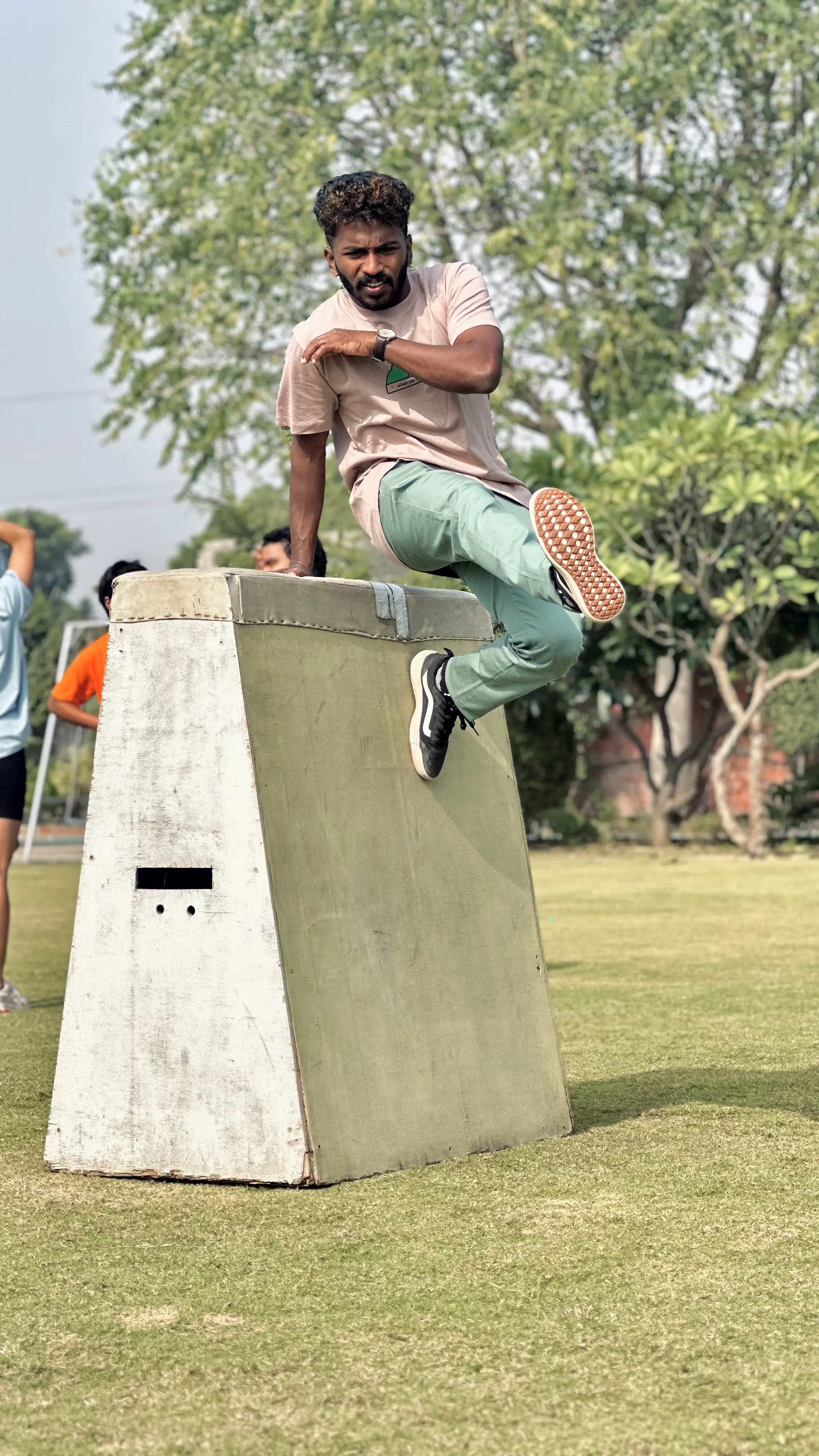 Coach Renjith vaulting over obstacle in Calicut