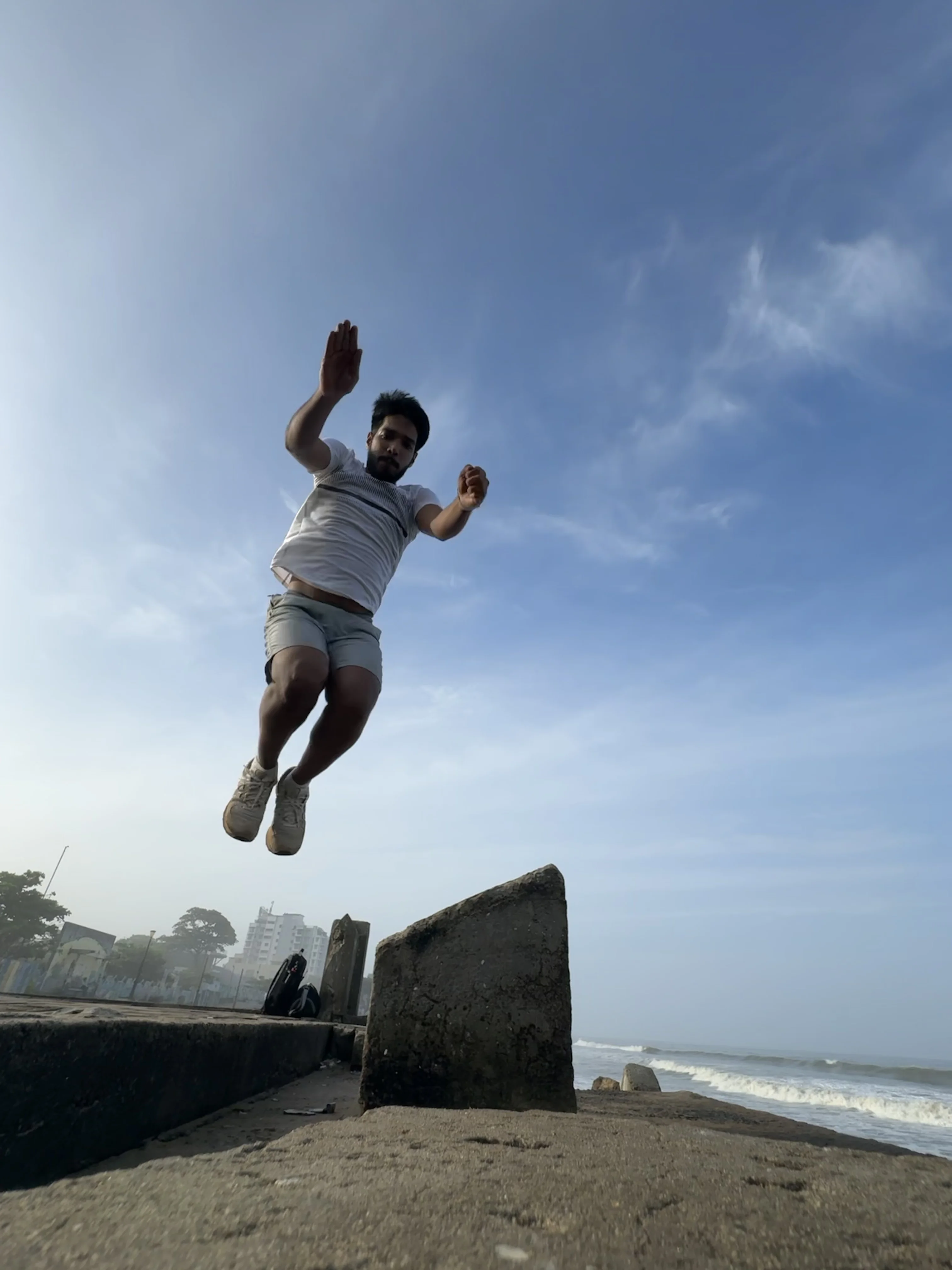 Coach Dadu sea wall precision leap at Calicut Beach
